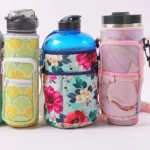 Three bottle carrier bags with lemon, floral and pink marble patterns around handled water bottles
