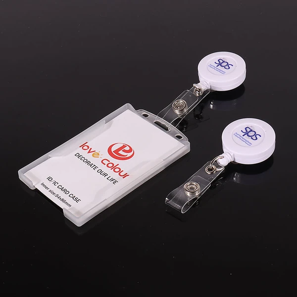 Two white round logo badge reels beside a clear ID card holder